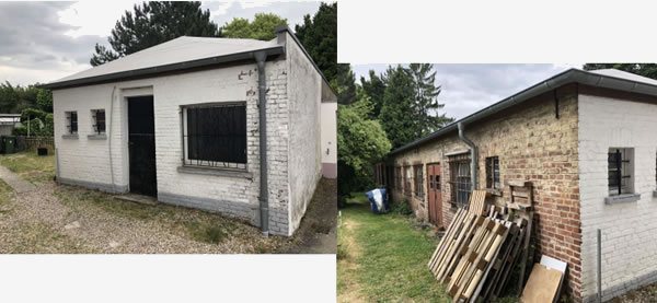 Zwei verfallene ehemalige Fabrikgebäude mit weißen und Backsteinmauern, die heute leer stehen und teilweise mit Holzresten zugestellt sind.